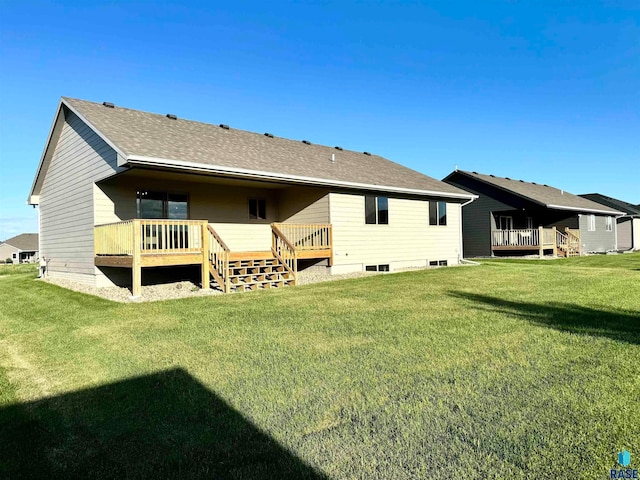 rear view of house with a lawn