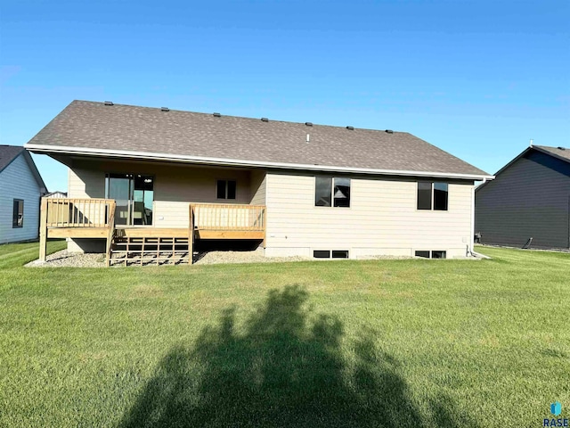 back of house with a yard and a wooden deck