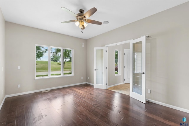 unfurnished room with french doors, ceiling fan, and wood-type flooring