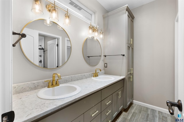 bathroom featuring vanity and wood-type flooring