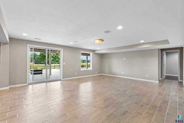 spare room with light hardwood / wood-style floors