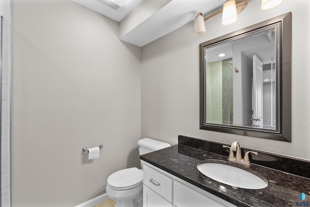 bathroom featuring toilet and vanity