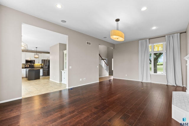 unfurnished living room featuring light hardwood / wood-style floors