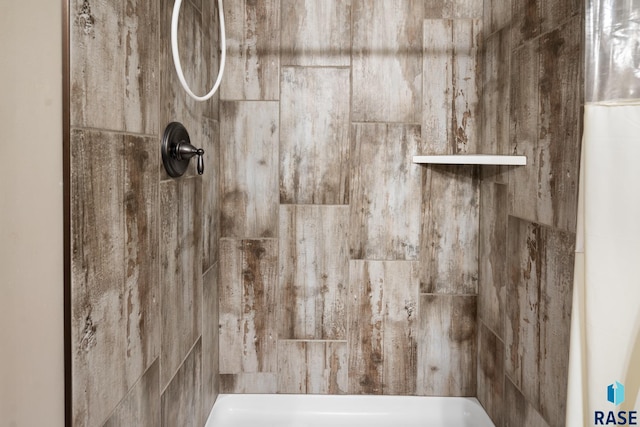 room details with a tile shower