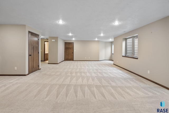 basement with light colored carpet