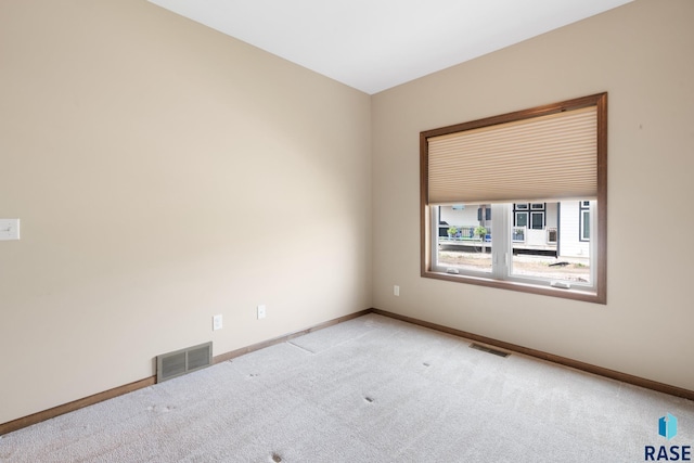 empty room featuring light carpet