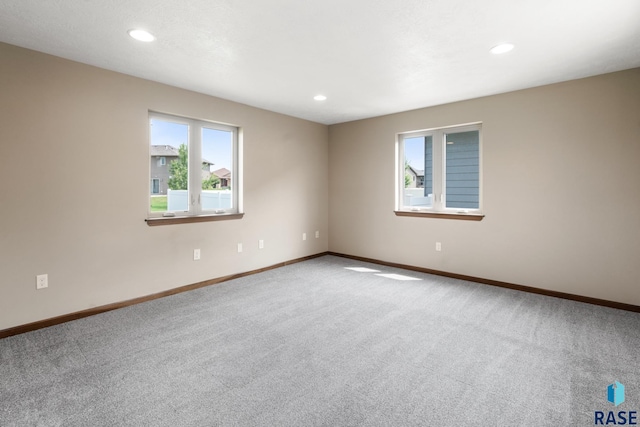 unfurnished room with carpet flooring