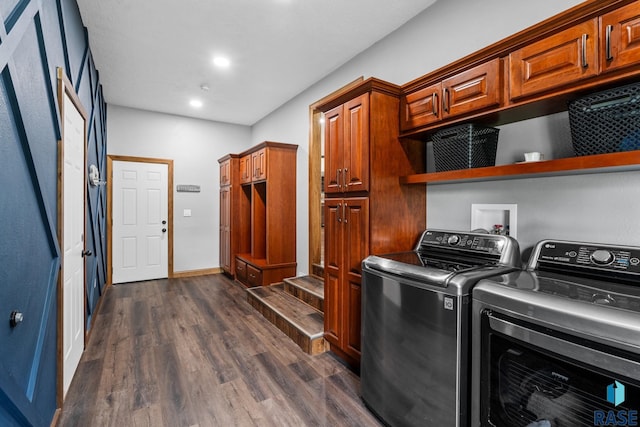 laundry area with cabinets, dark hardwood / wood-style flooring, and separate washer and dryer