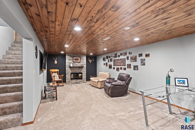 interior space with wood ceiling, carpet floors, and a fireplace