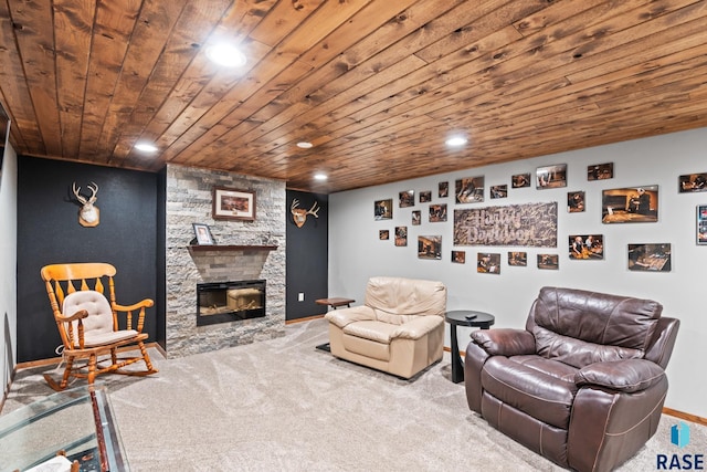 carpeted living room with wood ceiling and a stone fireplace