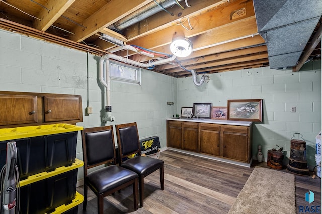 basement with light hardwood / wood-style floors