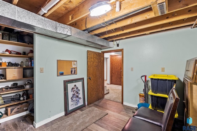 sitting room featuring wood-type flooring