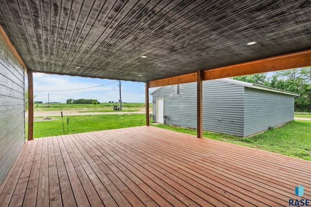 wooden terrace with a yard