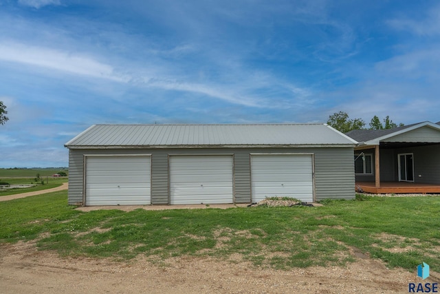 garage with a lawn