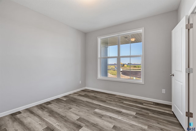 spare room featuring hardwood / wood-style floors