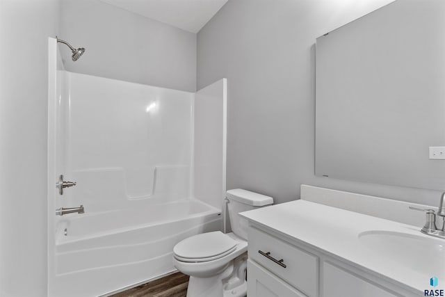 full bathroom with vanity, toilet, wood-type flooring, and shower / tub combination