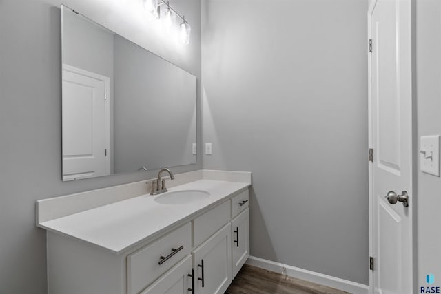 bathroom with vanity and wood-type flooring