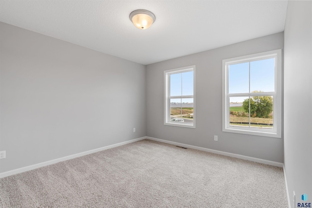 unfurnished room with carpet floors