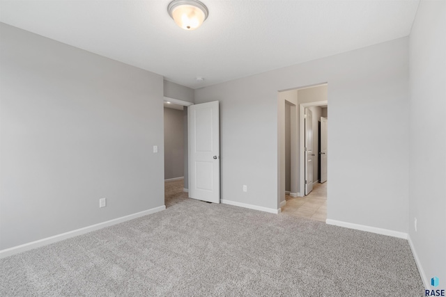 unfurnished bedroom with light carpet