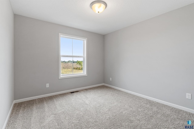 empty room featuring carpet flooring