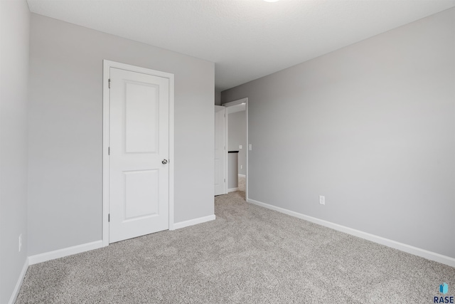 unfurnished bedroom featuring carpet flooring