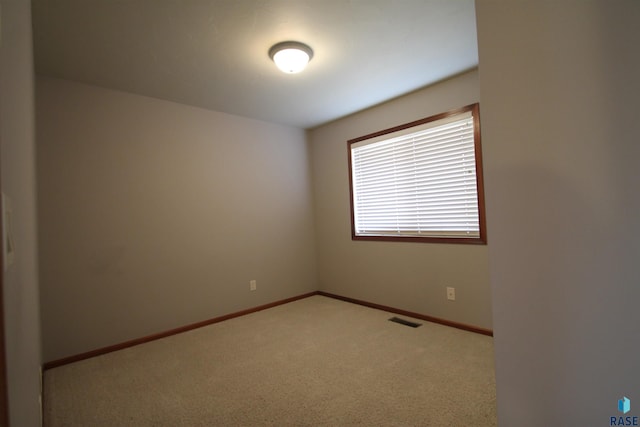 unfurnished room with carpet floors