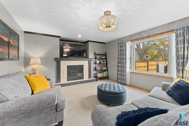 living room featuring light carpet, crown molding, and a premium fireplace