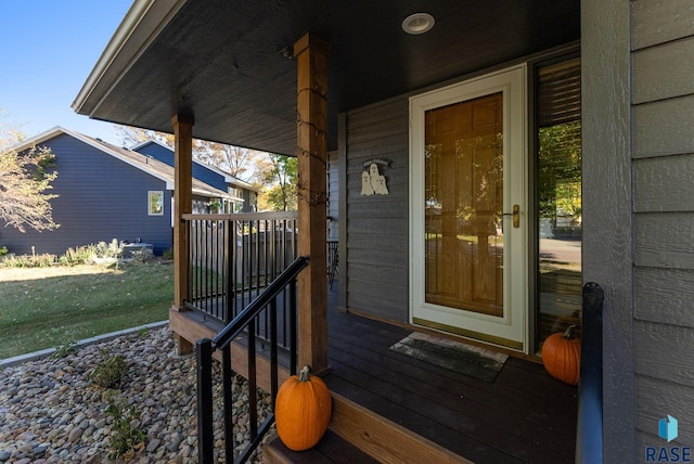 view of exterior entry featuring a yard