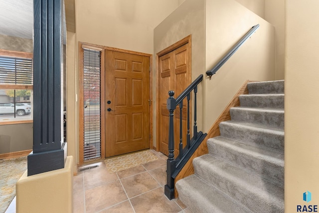 entrance foyer with light tile patterned flooring