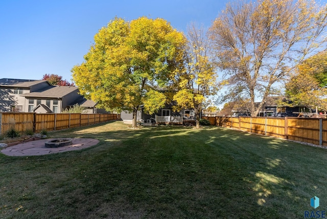 view of yard featuring a patio and a fire pit