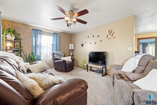 living room with carpet and ceiling fan