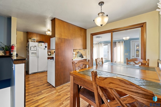 dining room featuring light hardwood / wood-style flooring