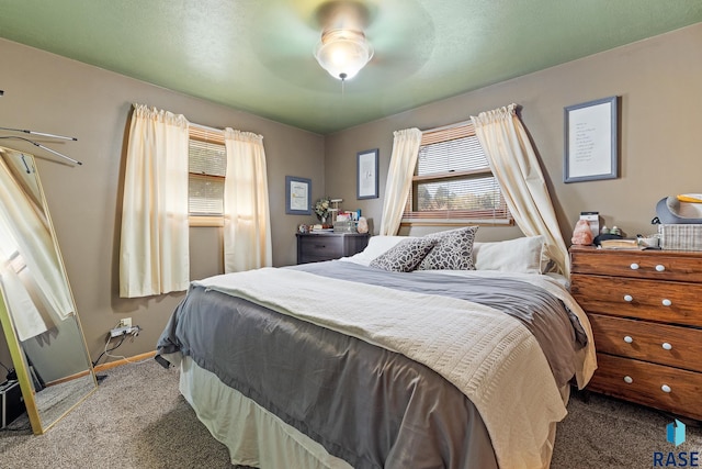 carpeted bedroom with ceiling fan