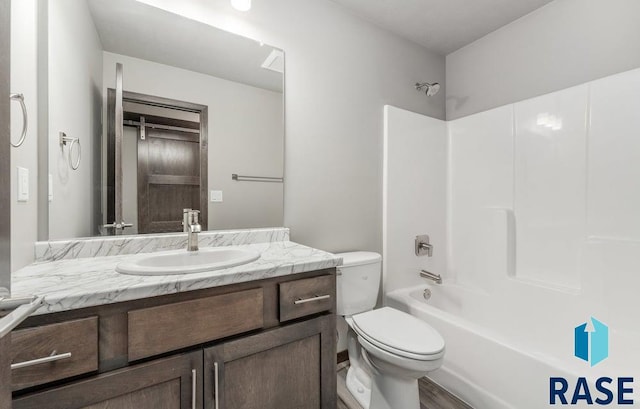 full bathroom featuring vanity, bathing tub / shower combination, toilet, and hardwood / wood-style flooring