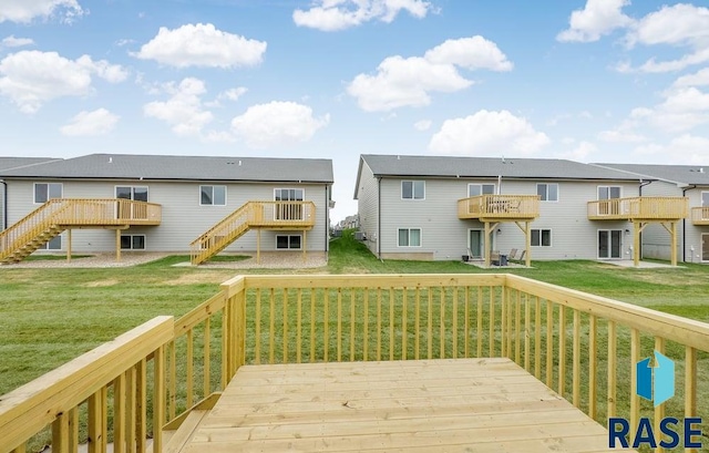 wooden deck with a lawn