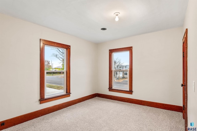 unfurnished room featuring carpet floors