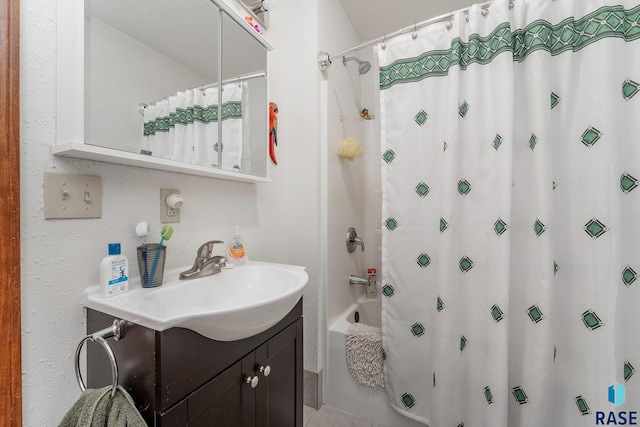 bathroom with vanity and shower / tub combo with curtain