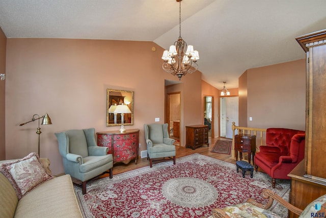 living room with light wood-type flooring, vaulted ceiling, and an inviting chandelier