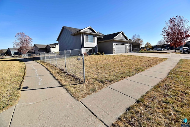 view of front facade featuring a front lawn and a garage