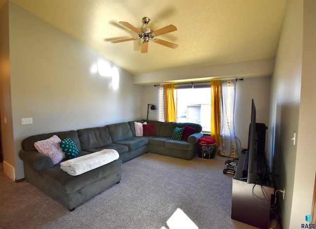 living room featuring ceiling fan, carpet, and lofted ceiling