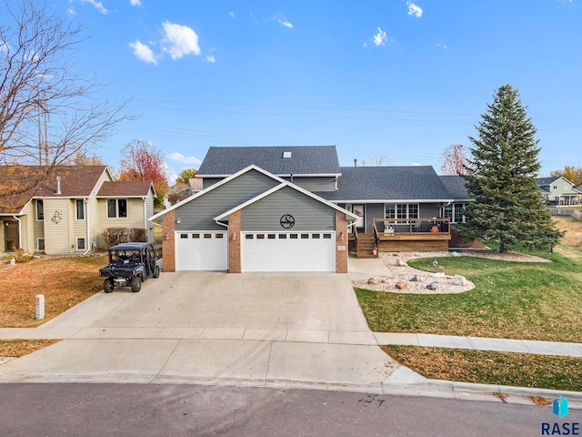 view of front of home with a garage and a front lawn