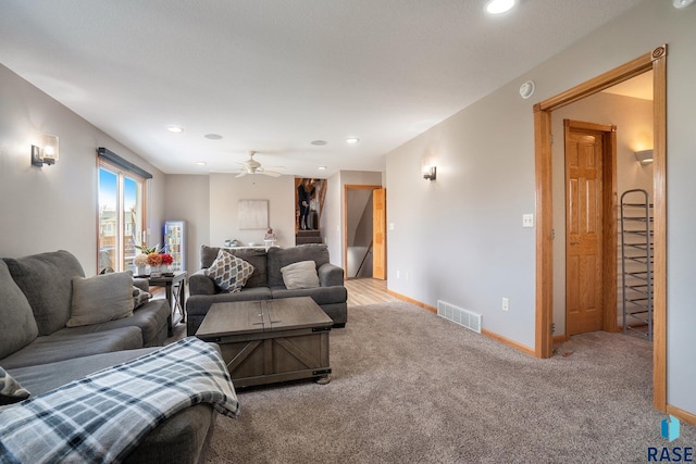 living room with carpet and ceiling fan