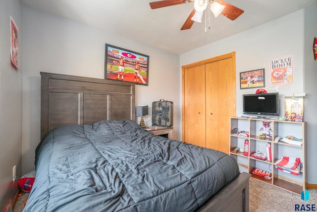 carpeted bedroom with a closet and ceiling fan