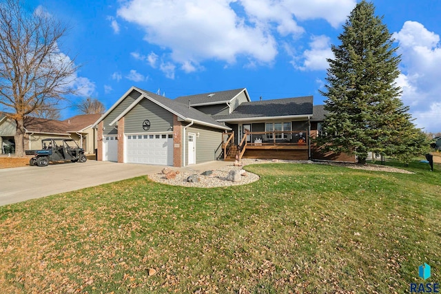 single story home with a front yard, covered porch, and a garage