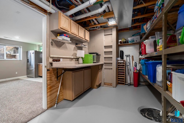 interior space featuring stainless steel fridge with ice dispenser