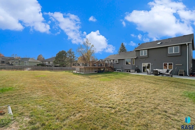 view of yard featuring a patio and a deck