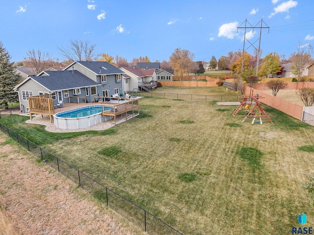 view of yard featuring a swimming pool side deck