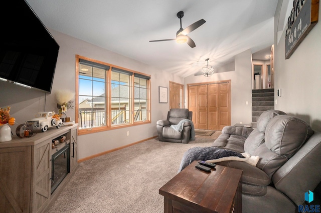 living room featuring carpet floors and ceiling fan