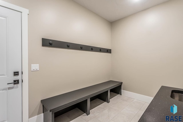 mudroom with light tile patterned floors