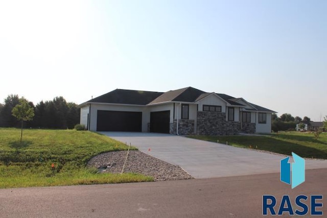 view of front of house featuring a garage and a front yard